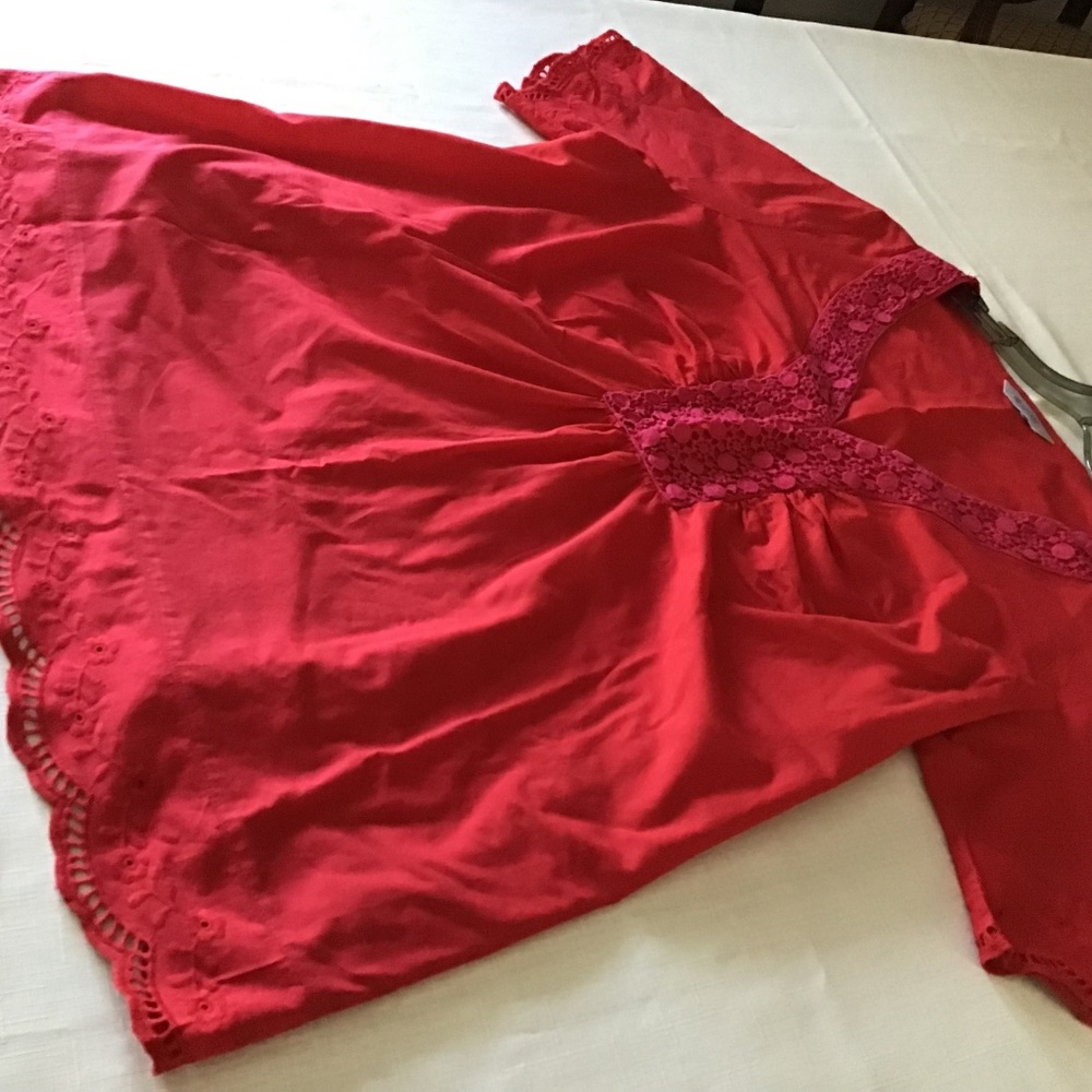 Red v-neck cotton A&E sports blouse with embroidered hem and sleeves